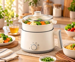 Multi Cook Electric Kettle with Steamer features 1.2L inner pot, double layered body, variable temperature control and wide mouth design. Ideal for tea, coffee, eggs, vegetables and boiling.