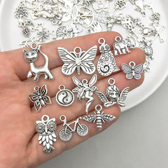 SYGA 100 Pieces Mixed Charms Pendant Charms Craft Supplies for Earrings Necklace Bracelet Jewellery DIY Making (Silver-001)